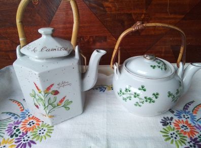 Two Wicker Handled Teapots
