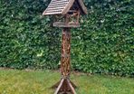 Bird feeders and basket stands .