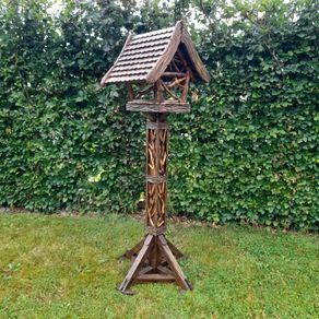 Bird feeders and basket stands .