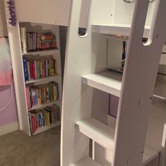 Loft bed with dressing table, drawers, wardrobe, bookshelf and bed