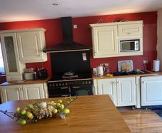 Kitchen + Island + Solid Oak Countertops + Integrated Dishwasher + black sink & gold mixer tap