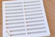 White plastic wall vent cover, adjustable ventilation grille with fly screen and slider shutter, room air vent panel