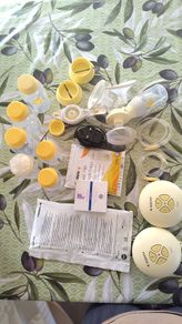 Madela single pump + bottles + nipples and extra bits
