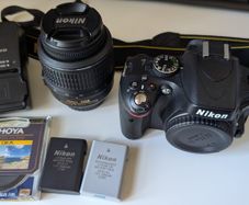 Nikon D5100 with lens, batteries, charger, bag
