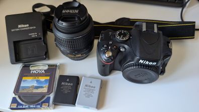 Nikon D5100 with lens, batteries, charger, bag