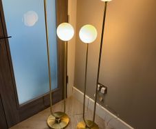 2 gold feature floor lamps
