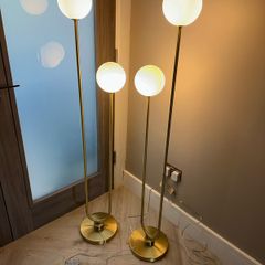 2 gold feature floor lamps