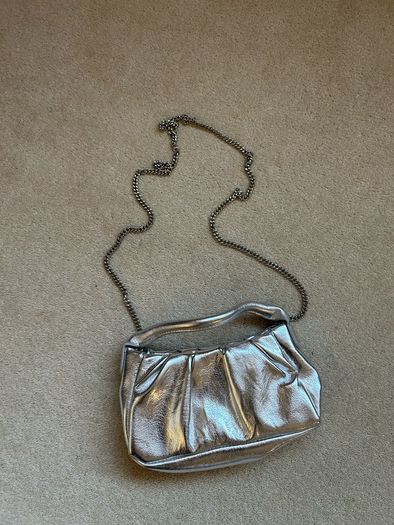 New silver mango clutch
