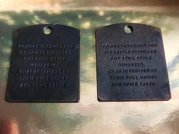 Powers whiskey medal