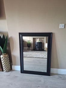 Modern black framed mirror in excellent condition.