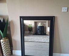 Modern black framed mirror in excellent condition.