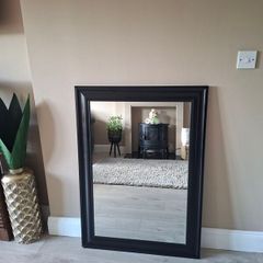 Modern black framed mirror in excellent condition.