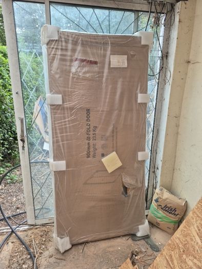 Bi fold shower door