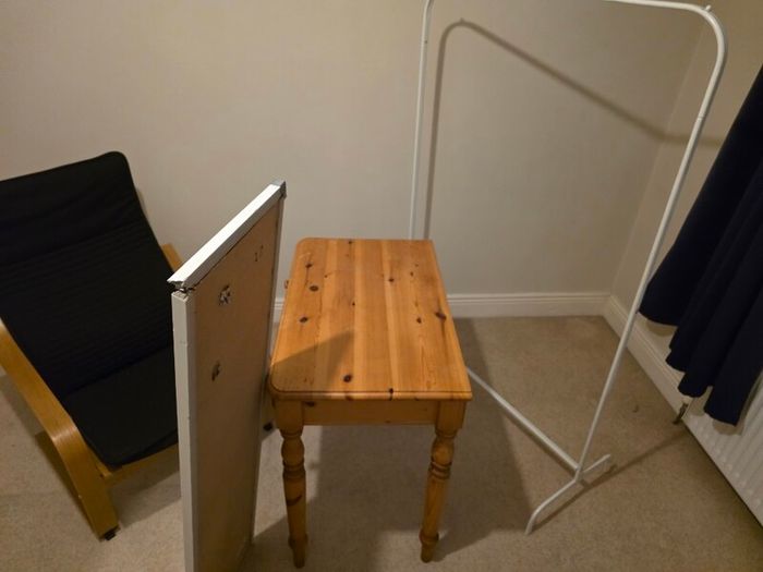 table , chair , mirror and cloths