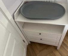 White baby changing unit with two drawers
