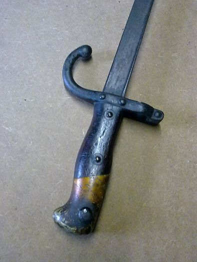 19th century French bayonet with brass and wooden handle.