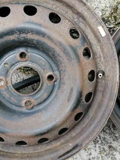 2 x steel rims 15", 4 stud, about 114mm ish from hole centre to the opposite home centre... Possibly fit a nissan etc