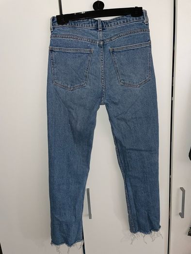 Distressed blue jeans