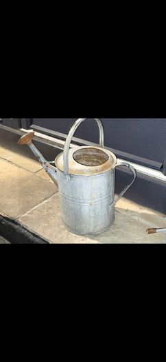 old zinc watering can