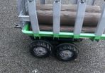 Rolly tipping trailer with logs