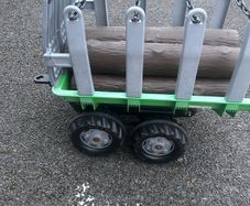 Rolly tipping trailer with logs