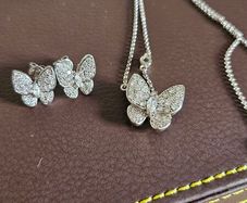 NEW - Silver butterfly necklace and stud earrings