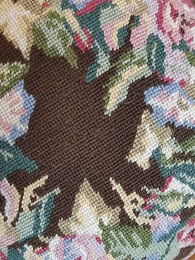 Vintage hand embroidered floral design on wooden base stool,