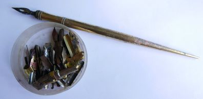 Vintage dip pen with collection of assorted nibs