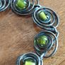 Vintage Twisted Bracelet with Green Glass Beads Inserts. Image 2