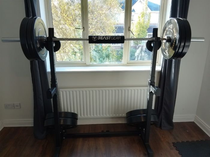 155kg Bumper Plate Set 7ft Olympic Bar and adjustable Squat Stands.