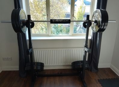 155kg Bumper Plate Set 7ft Olympic Bar and adjustable Squat Stands.