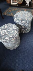 a pair of beautiful blue floral poofe's