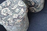 a pair of beautiful blue floral poofe's