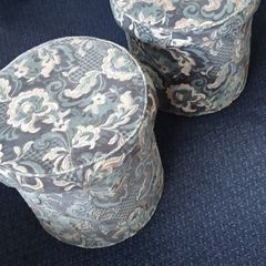 a pair of beautiful blue floral poofe's