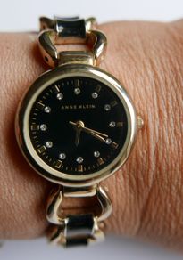 Anne Klein ladies watch - gold tone with black dial