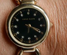Anne Klein ladies watch - gold tone with black dial
