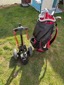 nike gold bag with trolly and clubs