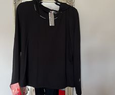 Naya black hooded top with white piping and design down back