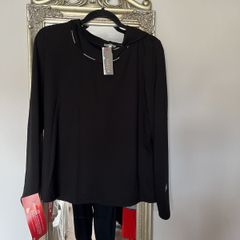 Naya black hooded top with white piping and design down back