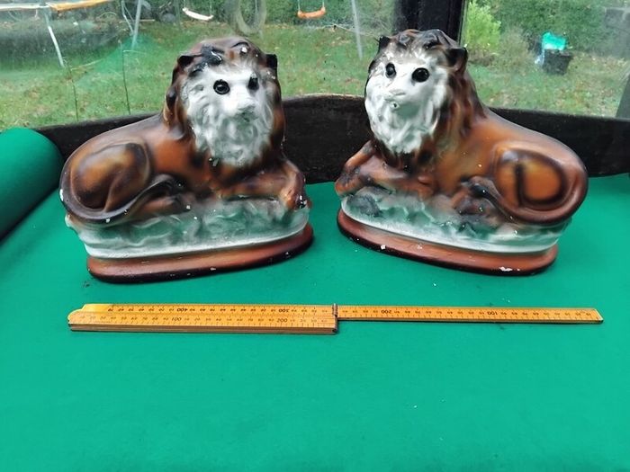 a pair of old chalk lions