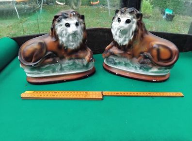 a pair of old chalk lions