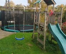 Wooden swing and slide climbing frame