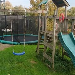 Wooden swing and slide climbing frame
