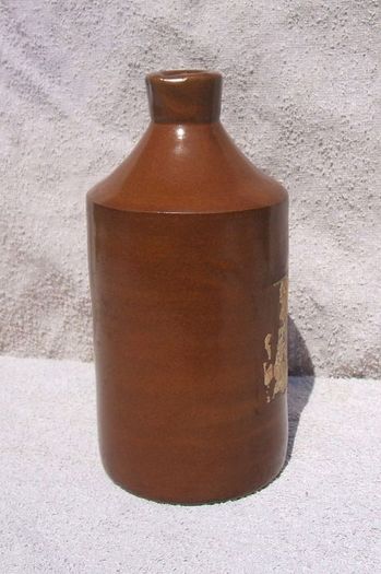 Stoneware antique ink bottle (large size 7.5" high) - made by Joseph Bourne of Denby (1880's - 1910's). Superb condition with remnants of label.