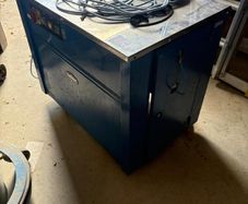 Box strapper machine