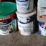 a selection of paint and a paint roller and some good paint brushes Image 4