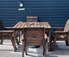 Solid wooden table and chairs. Good quality wood with nice and wide chairs for comfort. One lat missing on one chair