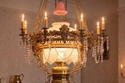 The is a very large old  brass coolie lamp.