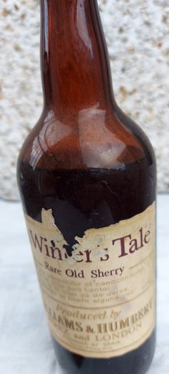 vintage bottle of winters tale sherry 3/4 full ,found in a old pub closed down,