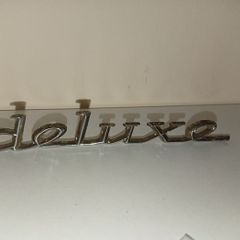 Classic Car " DELUXE " CAR BADGE, Good condition with 2 mounting pins vintage